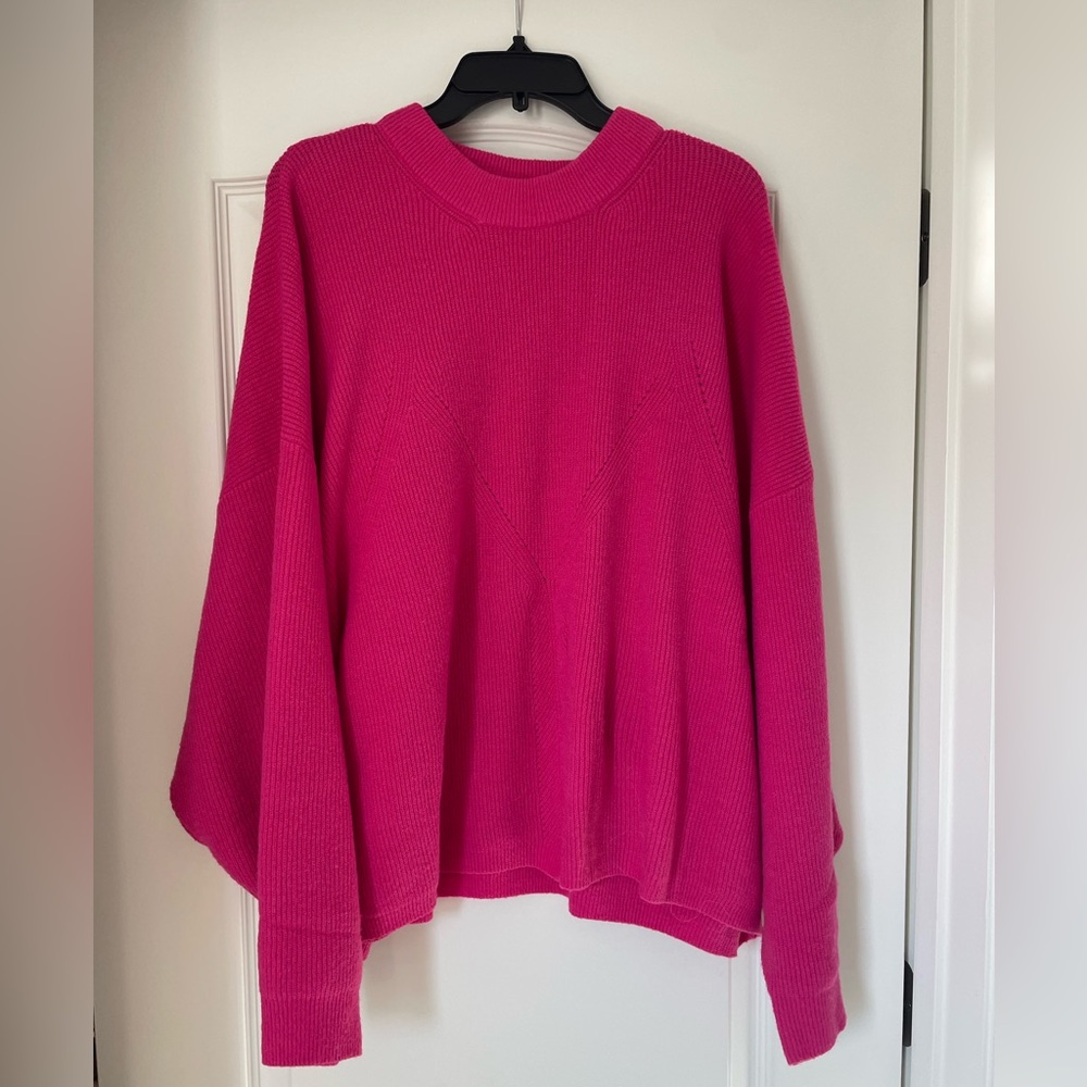 Bright pink First Love cozy sweater